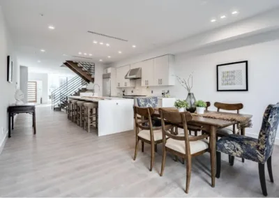 A kitchen and dining room with hardwood floors.